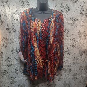 Valerie Stevens medium vivid print blouse with metal embellishments on neck.
